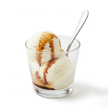 ice cream with caramel sauce in a glass isolated on white background.の素材