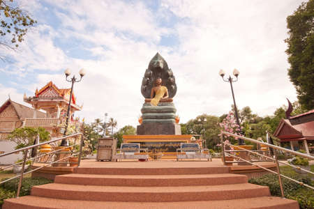 Buddha nature, meditation. And the head of a serpent cobra hood spread from the shoulder to the head of the Buddha, dirtyの写真素材