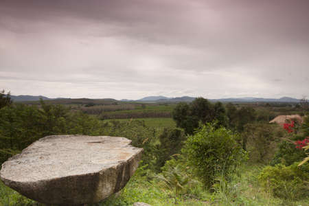 standing point on rocks and looking at mountain.の写真素材