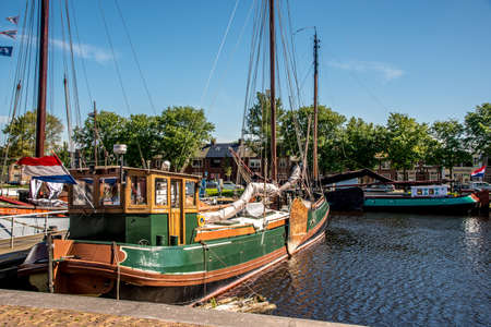 Den Helder, the Netherlands. July 2021. Old sailing boats in the harbor of Den Helder, the Netherlands. High quality photoの写真素材