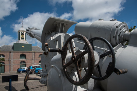 Den Helder, the Netherlands. July 20, 2021. Defensive artillery with the naval museum in the background. High quality photoのeditorial素材