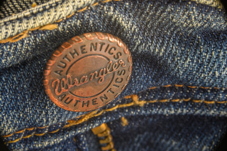 Den Helder, the Netherlands. September 2021. Close up of the buttons on a pair of jeans. High quality photoのeditorial素材