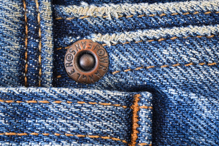 Den Helder, the Netherlands. September 2021. Close up of the buttons on a pair of jeans. High quality photoのeditorial素材
