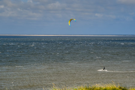 Den Helder, the Netherlands. November 2021. A kitesurfer off the coast near Den Helder, Nederland. ....