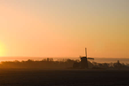 Sunrise in the polder with mill in background. High quality photoの写真素材