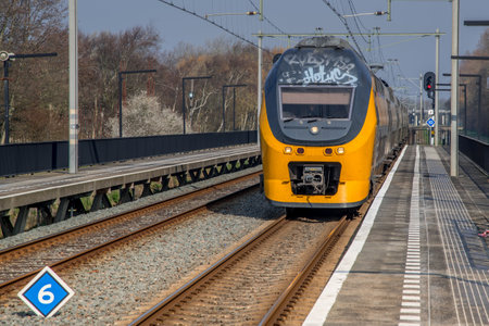 Amsterdam, Netherlands, march 2022. Dutch train in the landscape and in the central station. High quality photoのeditorial素材
