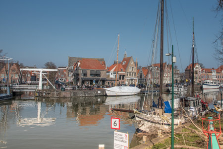 Hoorn, Netherlands, March 2022. The harbor of Hoorn with the old boats and historic facades. High quality photoのeditorial素材