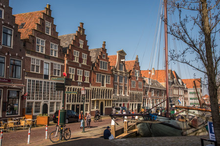 Hoorn, Netherlands, March 2022. The harbor of Hoorn with the old boats and historic facades. High quality photoのeditorial素材