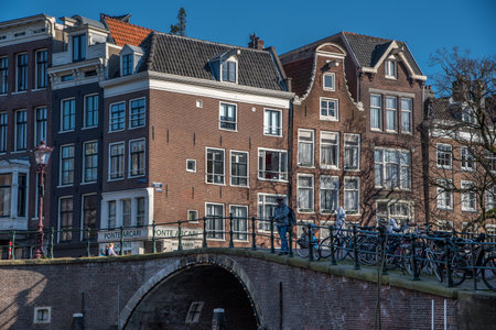 Amsterdam, Netherlands, April 2022. The historic canals and bridges of Amsterdam. High quality photoのeditorial素材