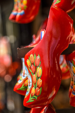 Lisse, Netherlands, April 2022. Clogs and wooden tulips, souvenirs of Holland. High quality photoのeditorial素材