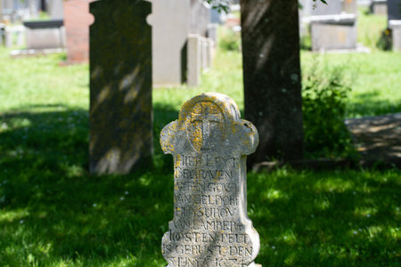 Den Helder, Netherlands, June 2022. Old dilapidated graves in the cemetery of Den Helder. High...