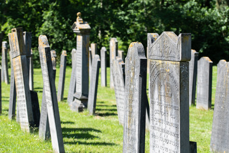 Den Helder, Netherlands, June 2022. Old dilapidated graves at the Jewish cemetery in Den Helder. High quality photo. Selective focus.のeditorial素材