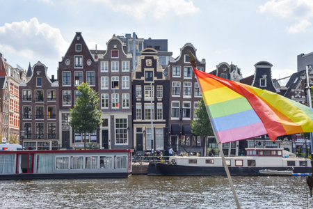 Amsterdam, Netherlands, May 2022. The dancing houses and the house boats at the Amstel river in Amsterdam. High quality photoのeditorial素材