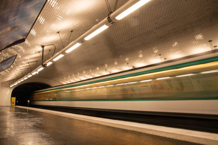 Paris, France. August 2022. A subway station with a passing train in Paris. High quality photo