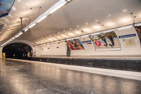 Paris, France. August 2022. A subway station with a passing train in Paris. High quality photoのeditorial素材
