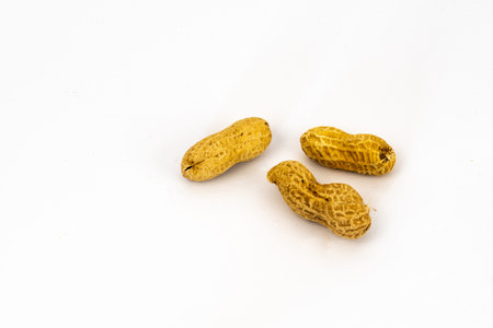 Netherlands. October 2022. Peanuts, isolated on white background. High quality photo