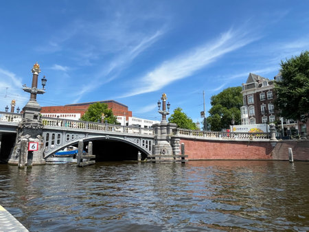 Amsterdam, Netherlands. June 23, 2023. The blue bridge over the Amstel River in Amsterdam. High quality photoのeditorial素材