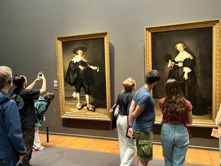 Amsterdam, Netherlands. August 6, 2023. Visitors admire one of the many paintings at the Rijksmuseum in Amsterdam. High quality photoのeditorial素材