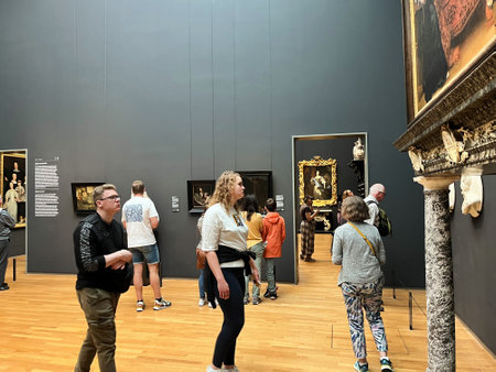 Amsterdam, Netherlands. August 6, 2023. Visitors admire one of the many paintings at the Rijksmuseum in Amsterdam. High quality photoのeditorial素材