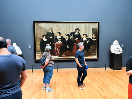 Amsterdam, Netherlands. August 6, 2023. Visitors admire one of the many paintings at the Rijksmuseum in Amsterdam. High quality photoのeditorial素材