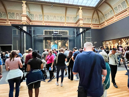 Amsterdam, Netherlands. August 6, 2023. Visitors admire one of the many paintings at the Rijksmuseum in Amsterdam. High quality photoのeditorial素材