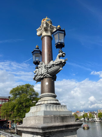 Amsterdam, Netherlands. August 26, 2023.One of the crowned pillars on the Blauwbrug in Amsterdam. High quality photoのeditorial素材