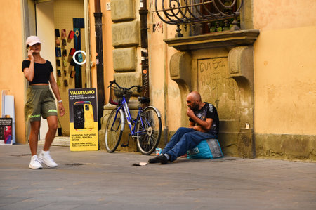 Pisa, Italy. September 16, 2023. A beggar on the streets of Pisa. High quality photoの写真素材
