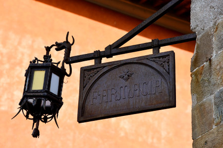 Pisa, Italy. September 16, 2023. An old signboard at a pharmacy in Pisa, Italy.のeditorial素材