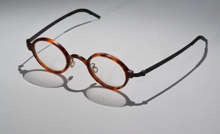 Den Helder, Netherlands. November 2023. A pair of glasses with shadow on white background. High quality photoの写真素材