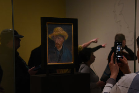 Amsterdam, Netherlands. January 20, 2024. Visitors admire the paintings of Vincent van Gogh. High quality photoのeditorial素材
