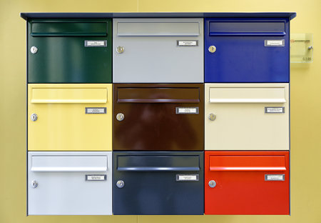Den Helder, Netherlands. March 1, 2024. Multi colored letter boxes in a community center. High quality photoのeditorial素材