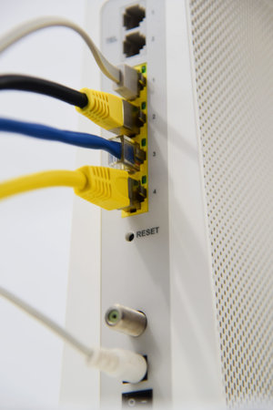 Netherlands. December 2024. Computer technology. A close up of a modem and cables. High quality photoの写真素材