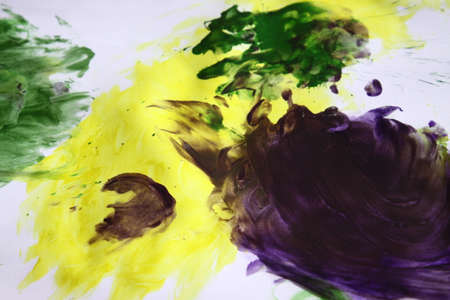 blue green yellow watercolor on white colored paperの写真素材