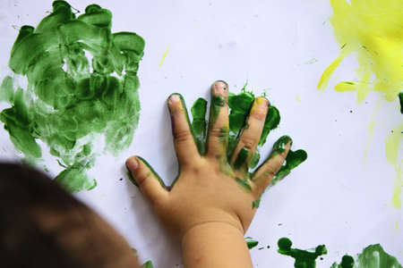 toddler hands playing watercolorの写真素材