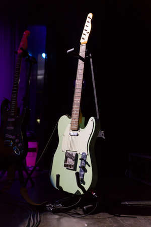 Vintage guitar on the stage of a concertの写真素材