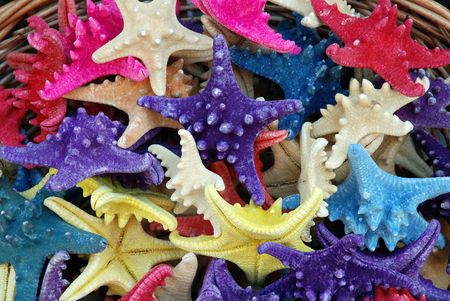 A basket filled with colorfull starfish on the beautiful isle of Crete (Greece)の写真素材