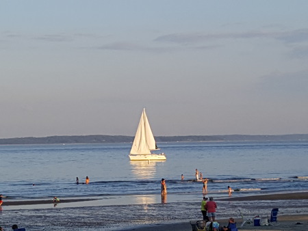 Sailboat Reflections at Sunsetの写真素材