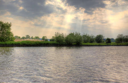 sun is trying to vaporize the cloudsの写真素材