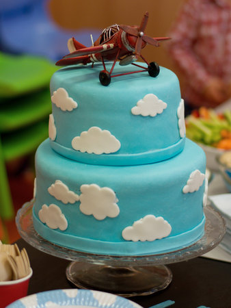 Beautiful toy airplane as a cake decoration. Beautiful birthday cake.