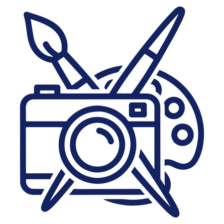 A graphic icon featuring a camera with a paintbrush and palette on a white background