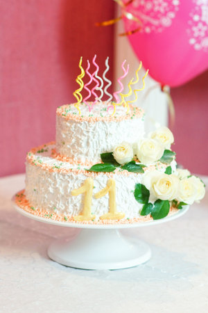 white floral wedding cake on restaurant interior backgroundの写真素材