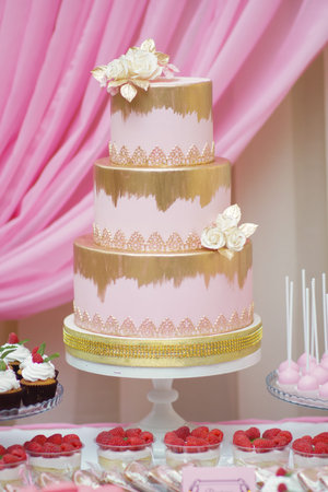 white floral wedding cake on restaurant interior background