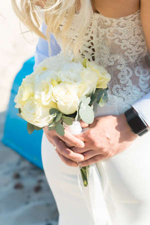 Bride and Groom at Sunset on a Beautiful Beach, Romantic Married Coupleの写真素材
