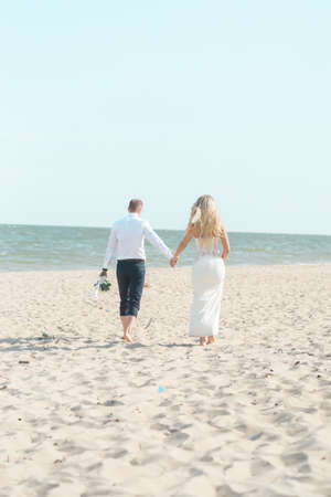 beautiful couple groom and bride on the beachの写真素材