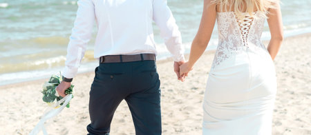 beautiful couple groom and bride on the beach