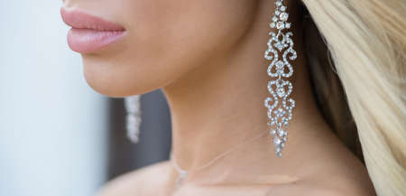 Beautiful woman with bridal make-up, hairdo and perfect skin . Bridal look. Beautiful sexy lipsの写真素材