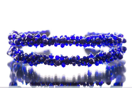 stones of blue color on the rim for the head of white backgraundの写真素材