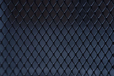 macro gray metallic grid with lighting effects. background monochrome. background metal. place for textの写真素材