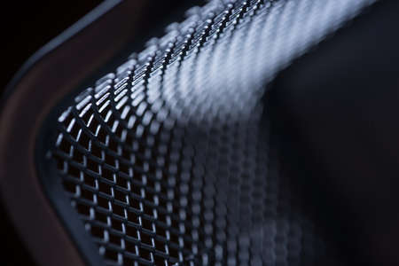 macro gray metallic grid with lighting effects. background monochrome. background metal. place for textの写真素材