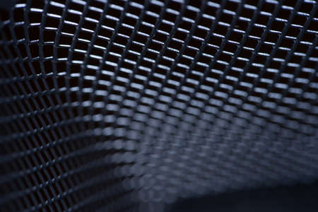 macro gray metallic grid with lighting effects. background monochrome. background metal. place for textの写真素材